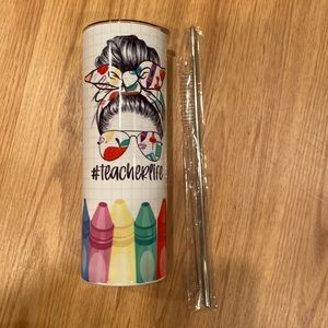 Brand new in box skinny tumbler that says “#teacherlife.”